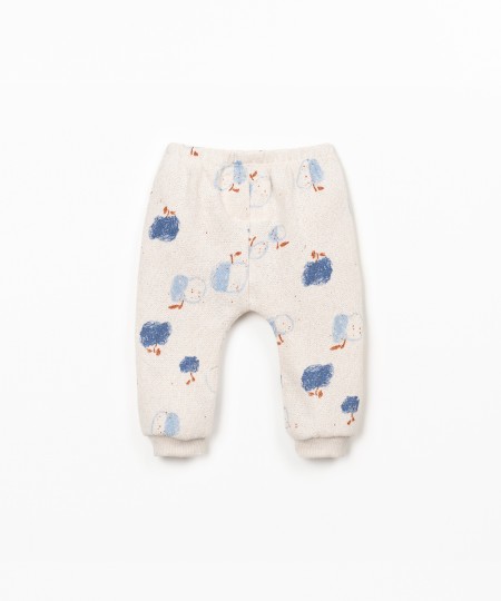 Calça de malha com estampado de maças
