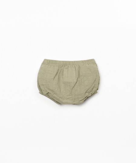 Calção de tecido comm bolso
