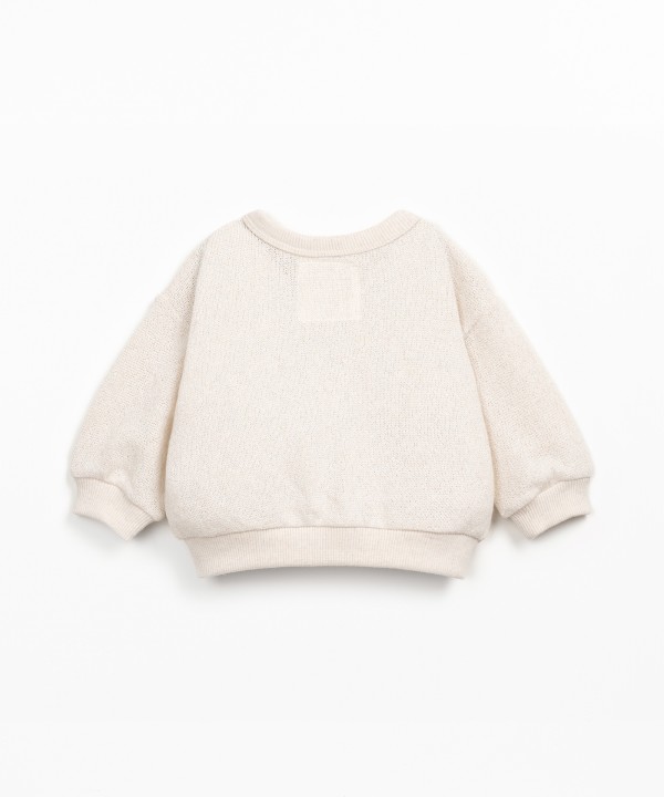 Knit cardigan with Re(Play) yarn