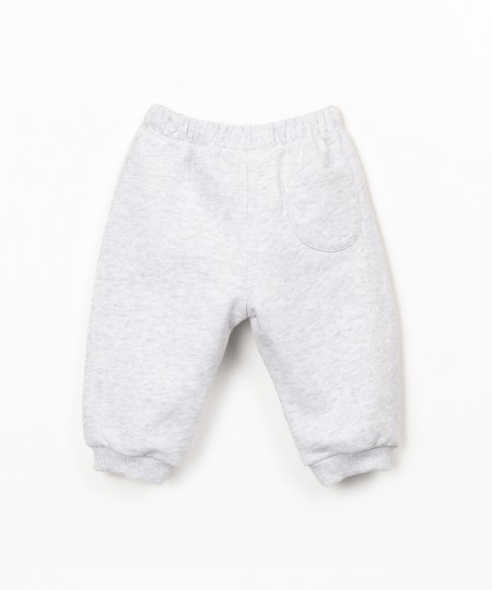 Trousers with decorative drawstring