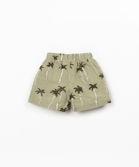Pantalones cortos de tejido con estampado de palmeras