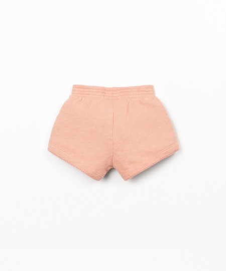 Pantalón corto con cintura elástica y lazo decorativo
