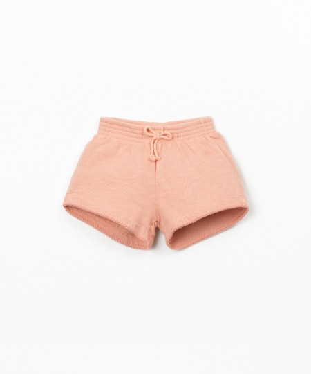 Pantalón corto con cintura elástica y lazo decorativo