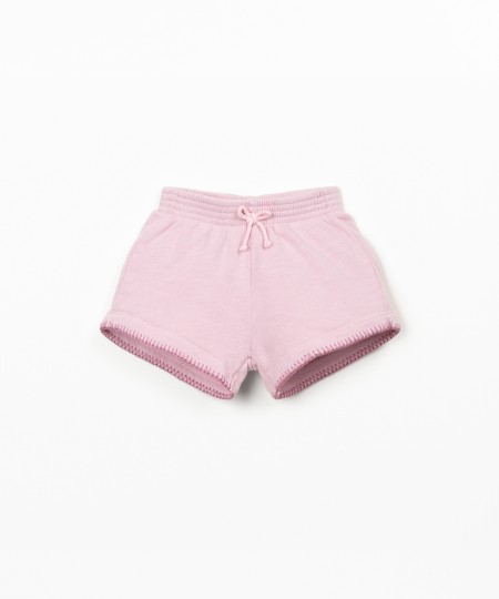 Pantalón corto con cintura elástica y lazo decorativo