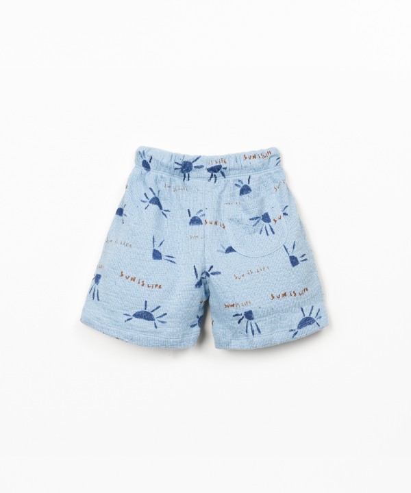Pantaloncini in maglina con stampa di sole