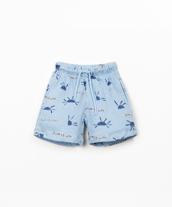 Pantaloncini in maglina con stampa di sole
