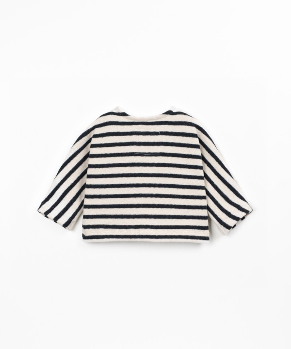Knit sweater with a blend of natural fibers and recycled cotton