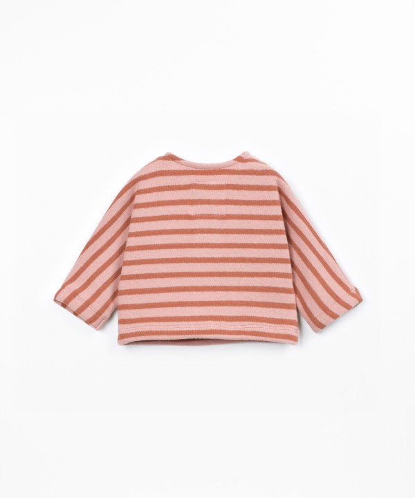 Knit sweater with a blend of natural fibers and recycled cotton