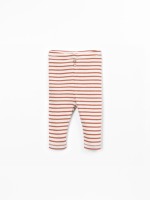 Leggings a rayas con botones decorativos de coco.