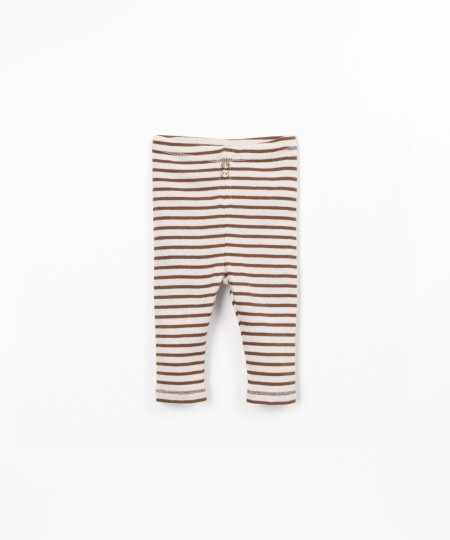 Striped leggings with decorative coconut buttons