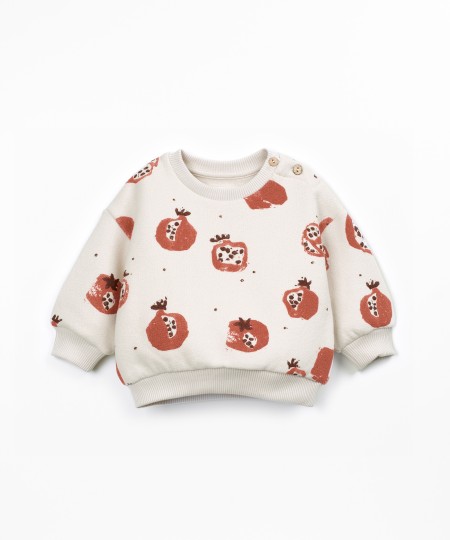 Knit sweater with shoulder opening