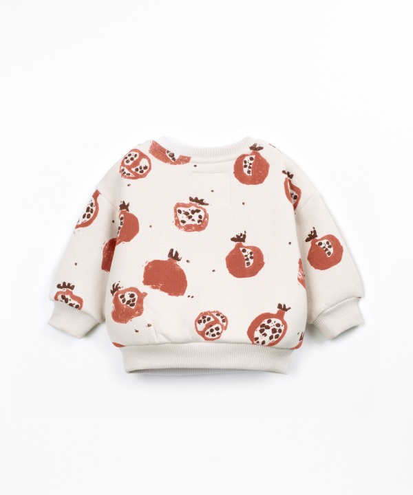 Knit sweater with shoulder opening