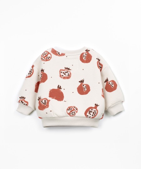 Knit sweater with shoulder opening