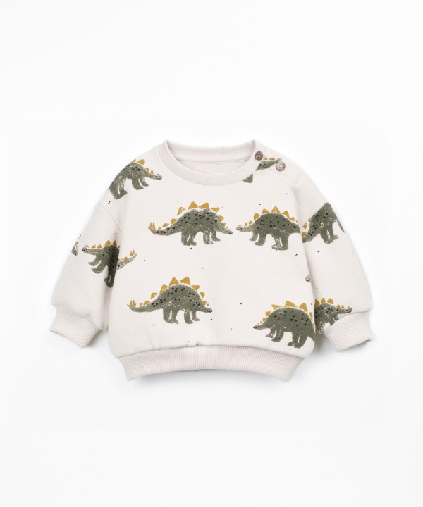 Knit sweater with shoulder opening