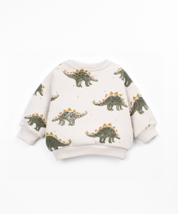 Knit sweater with shoulder opening