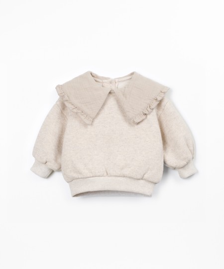 Sweater with a mix of natural and recycled fibers