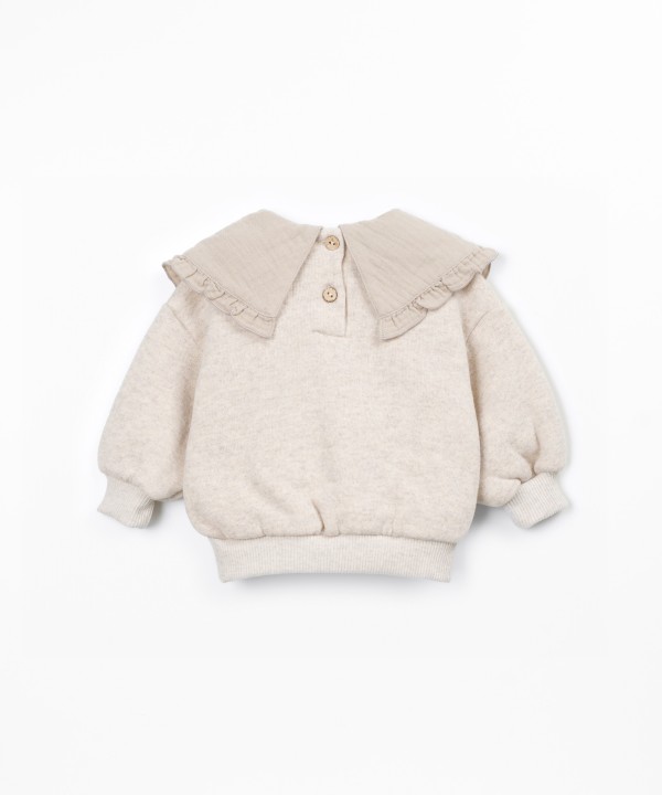 Sweater with a mix of natural and recycled fibers