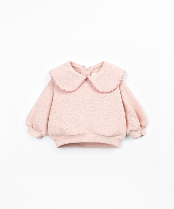 Knit sweater with recycled fibers