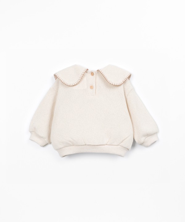 Knit sweater with recycled fibers