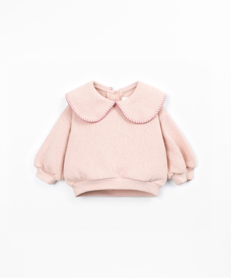 Knit sweater with recycled fibers