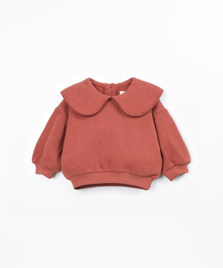 Knit sweater with recycled fibers