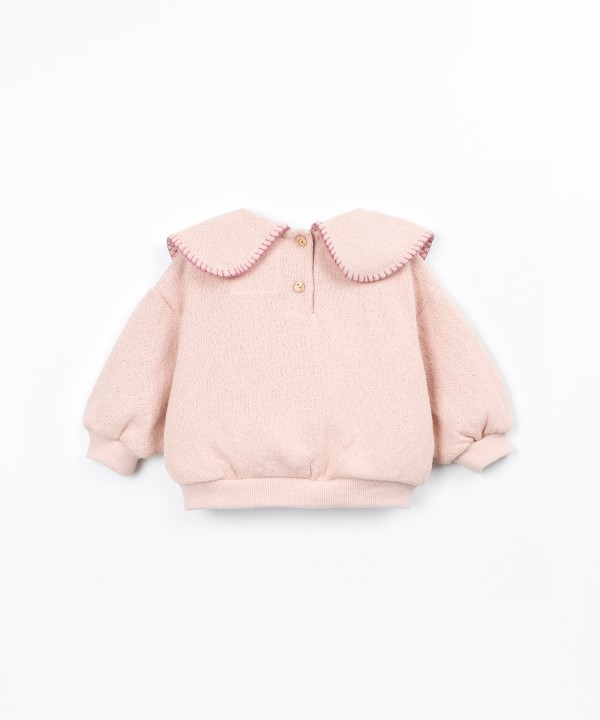 Knit sweater with recycled fibers