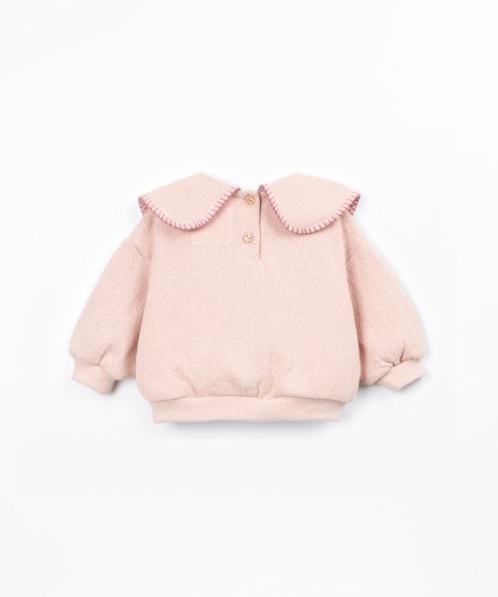 Knit sweater with recycled fibers