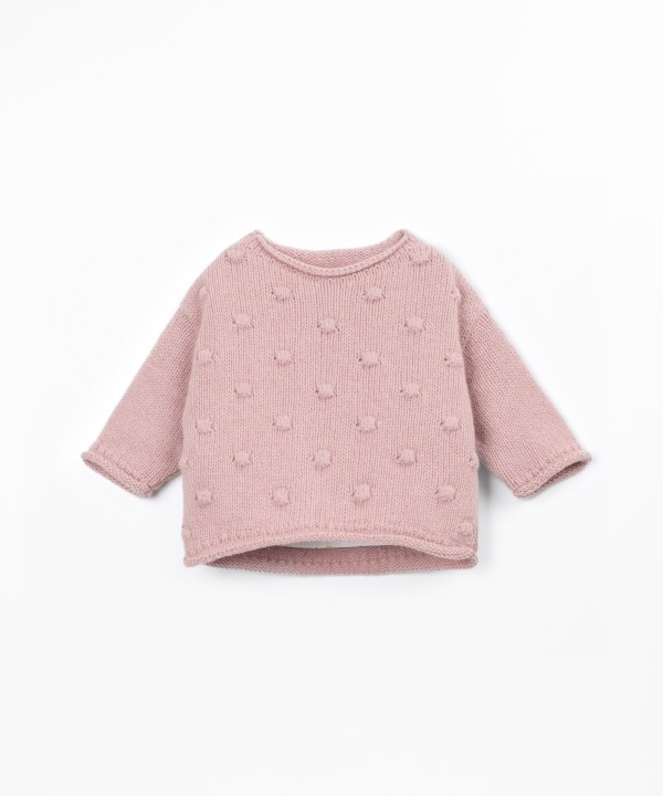 Pull en tricot avec dos plus long