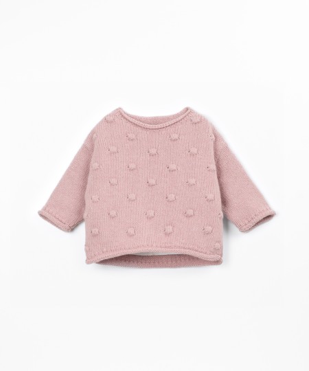 Pull en tricot avec dos plus long