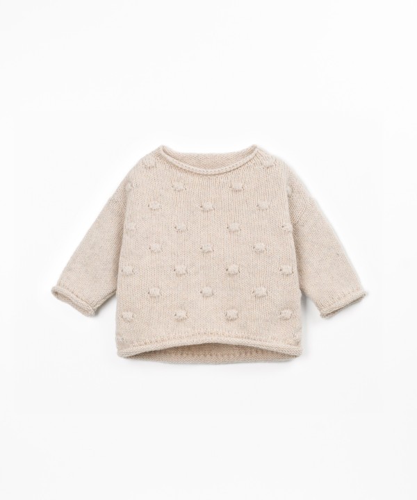 Pull tricoté avec dos plus long