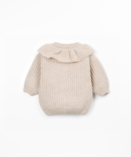 Knitted sweater with recycled fibers
