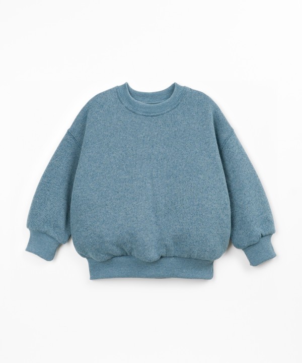 Sweater with a mix of cotton, recycled cotton, and recycled polyester