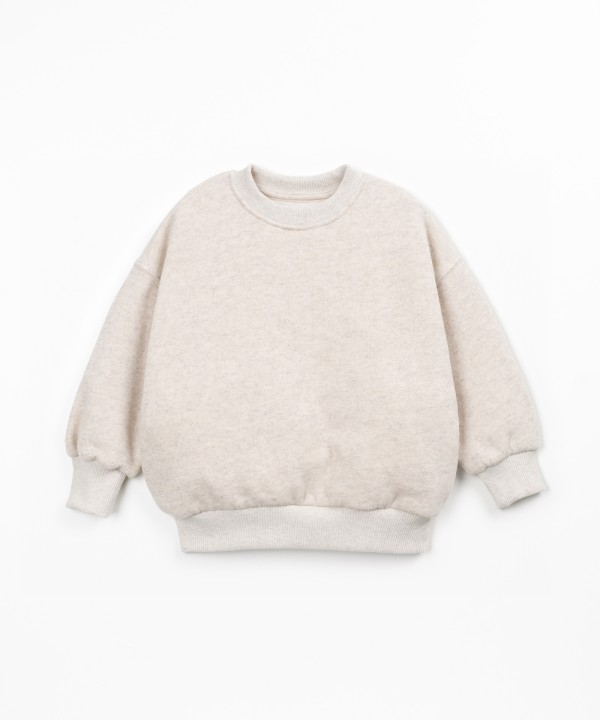 Sweater with a blend of cotton, recycled cotton, and recycled polyester