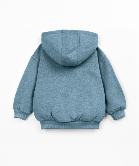 Veste en maille avec capuche et fermeture éclair