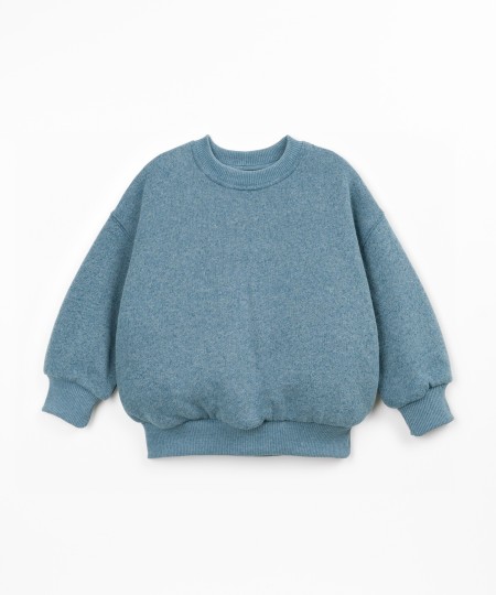 Sweater with a mix of cotton, recycled cotton, and recycled polyester