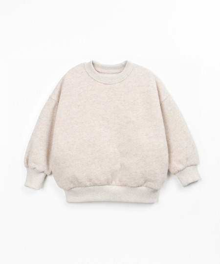 Sweater with a blend of cotton, recycled cotton, and recycled polyester