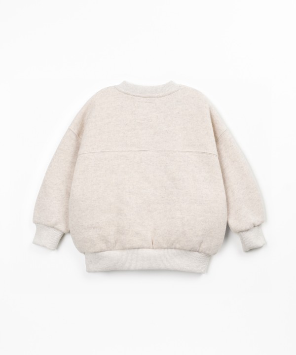 Sweater with a blend of cotton, recycled cotton, and recycled polyester