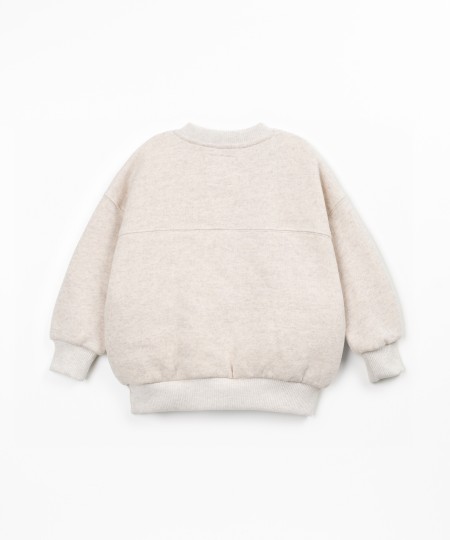 Sweater with a blend of cotton, recycled cotton, and recycled polyester