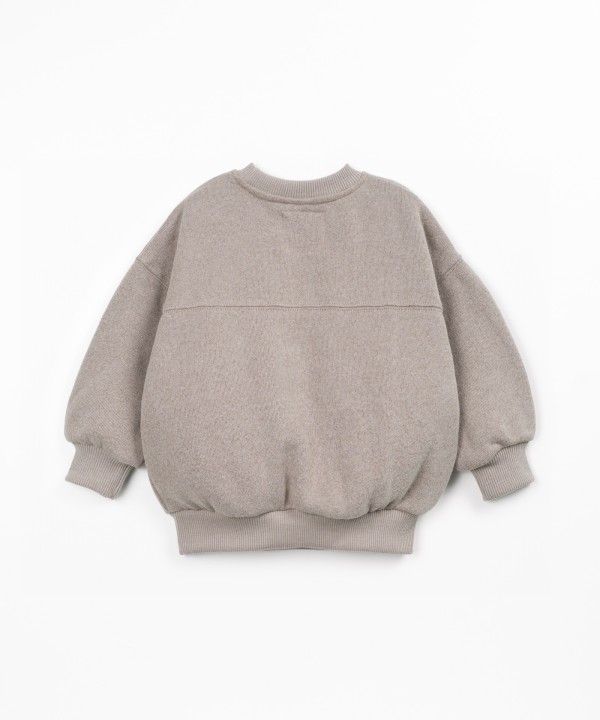 Sweater with a blend of cotton, recycled cotton, and recycled polyester