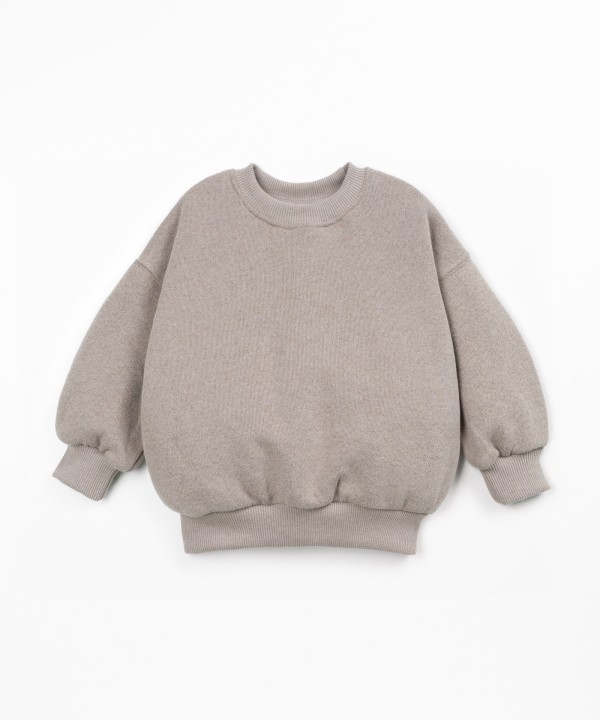 Sweater with a blend of cotton, recycled cotton, and recycled polyester