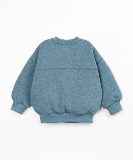 Sweater with a mix of cotton, recycled cotton, and recycled polyester