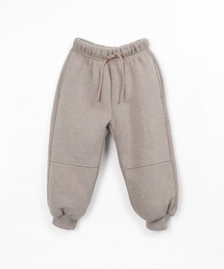 Trousers with a blend of cotton, recycled cotton, and recycled polyester