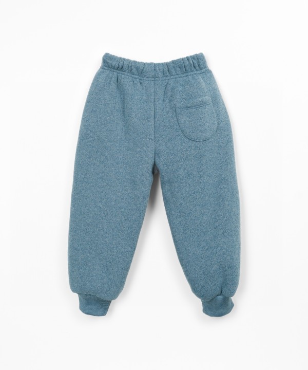 Trousers with a blend of cotton, recycled cotton, and recycled polyester