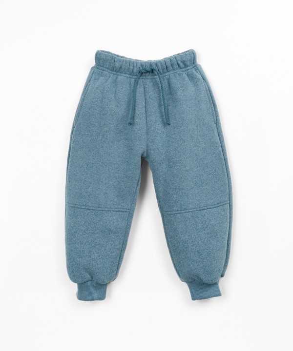 Trousers with a blend of cotton, recycled cotton, and recycled polyester