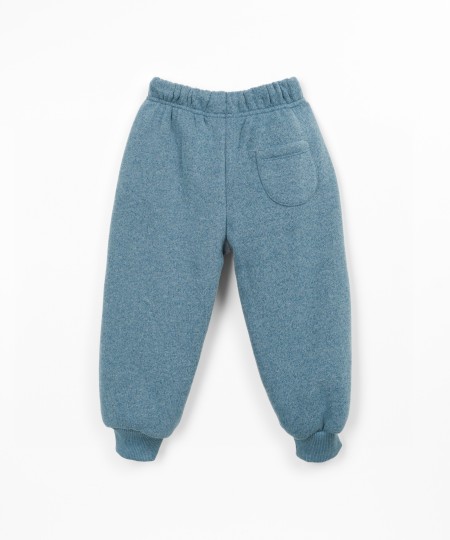 Trousers with a blend of cotton, recycled cotton, and recycled polyester