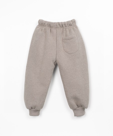 Trousers with a blend of cotton, recycled cotton, and recycled polyester