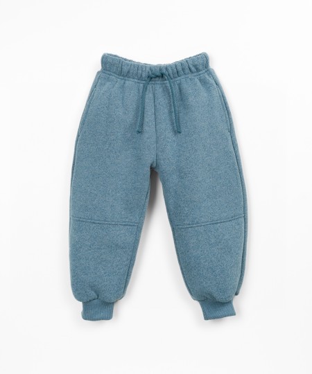 Trousers with a blend of cotton, recycled cotton, and recycled polyester