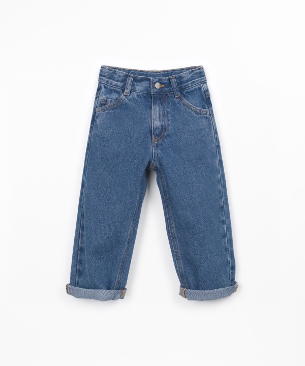 Denim trousers with adjustable belt