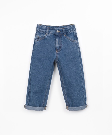 Denim trousers with adjustable belt