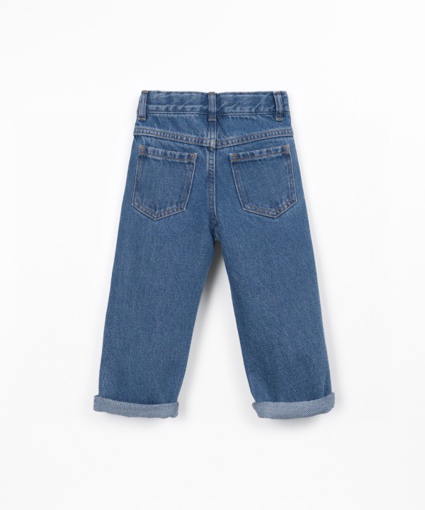 Denim trousers with adjustable belt